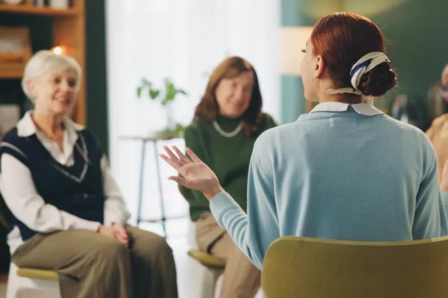Therapist talking to their clients during cbt therapy session.