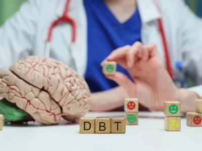 A doctor displaying toys to showcase DBT Therapy.